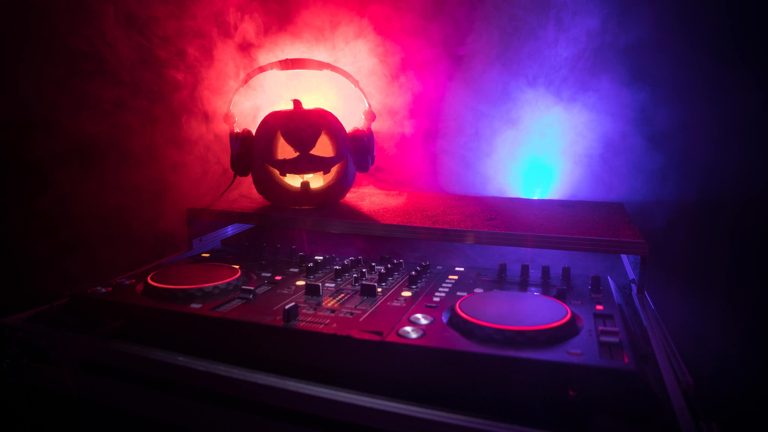 A pumpkin wearing headphones