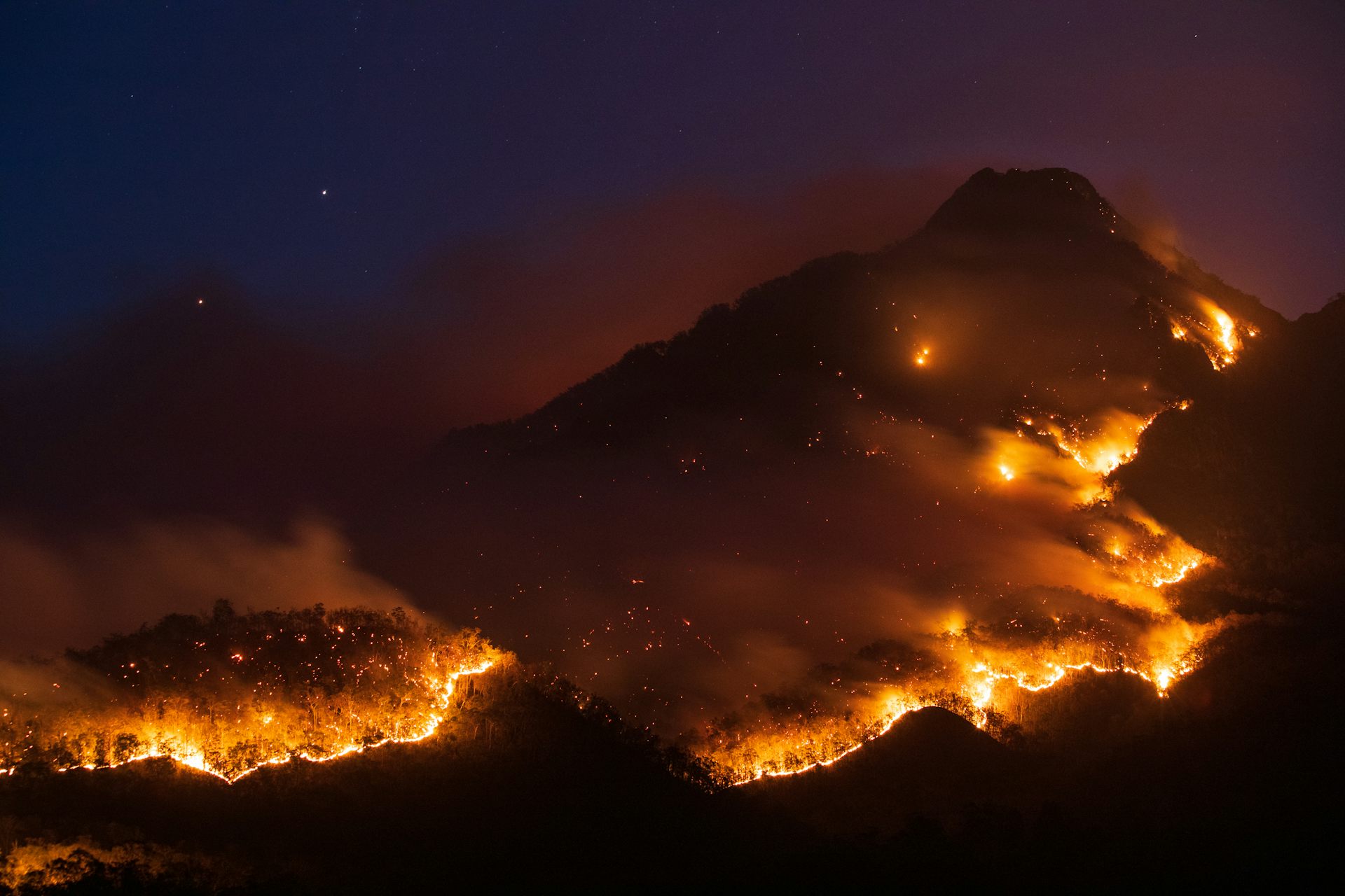 nightime view of bushfire covering the hillside
