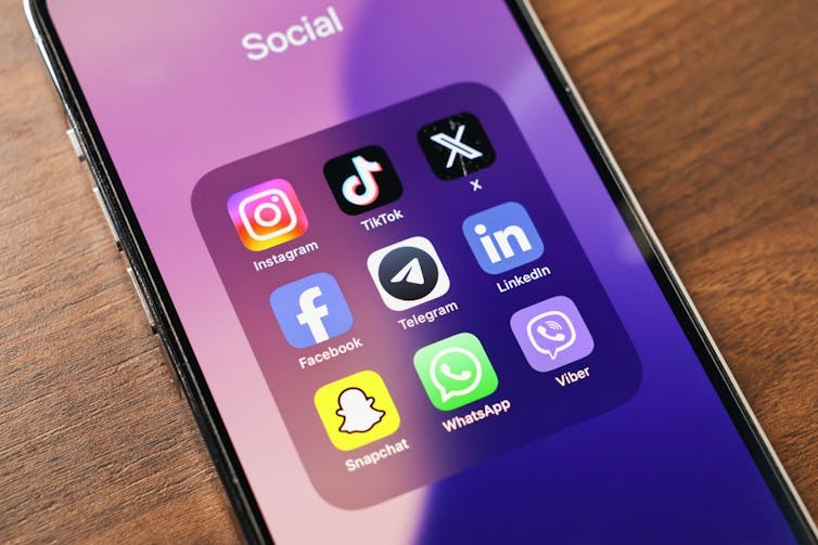 A phone screen showing a number of different social media apps.