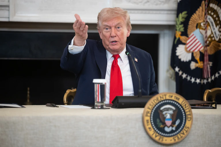 Donald Trump speaks during a meeting at the White House.