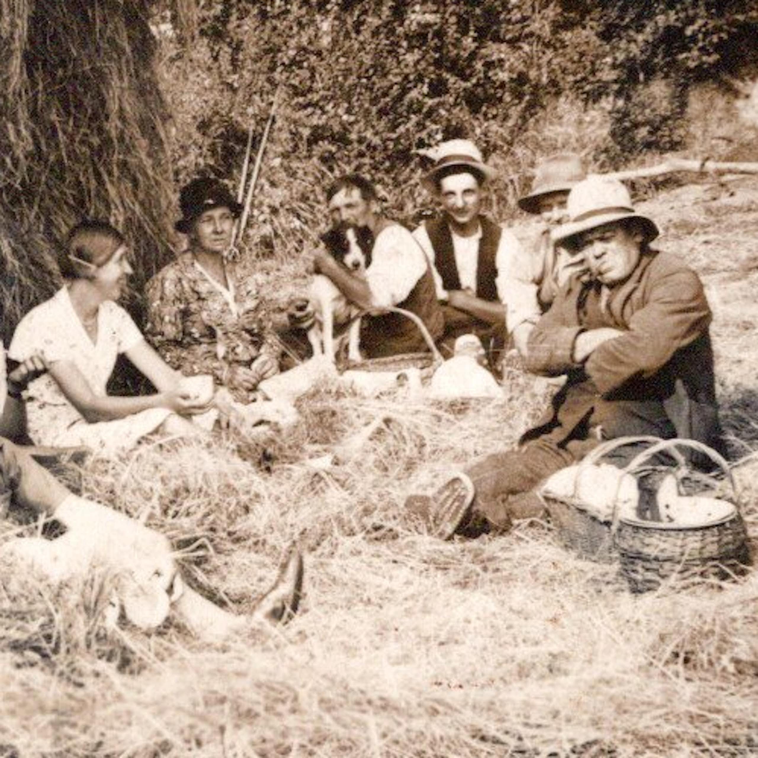 Farm labourers sat having what looks like a picnic