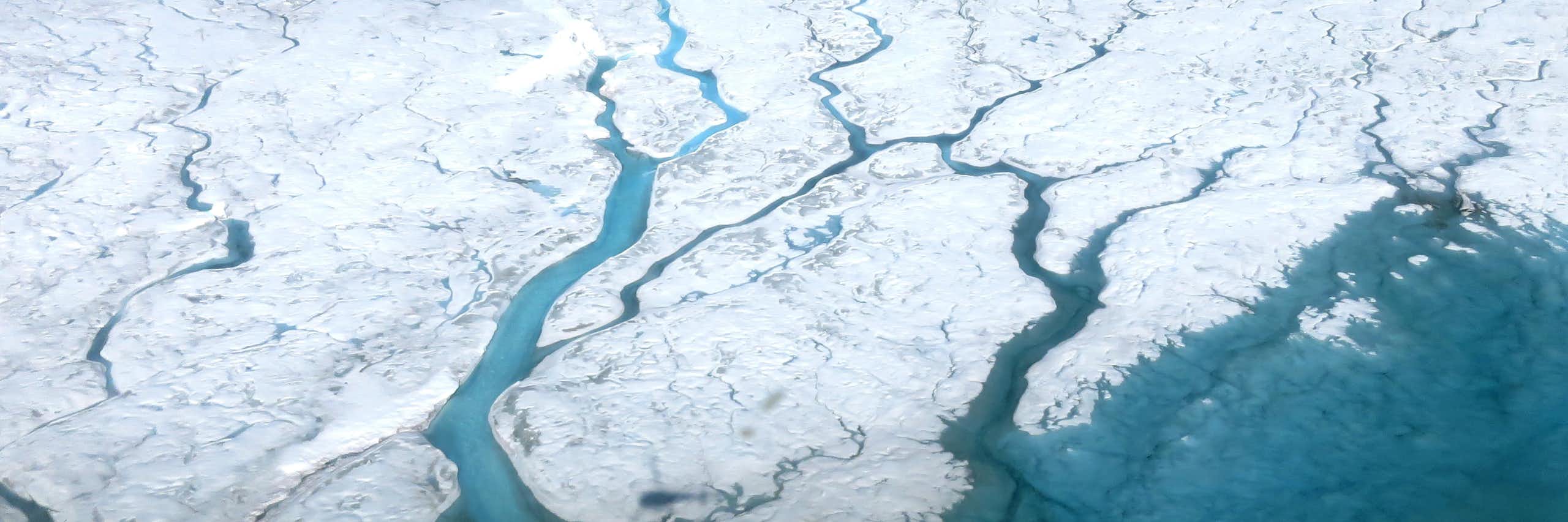 An aerial view of meltwater on the ice sheet
