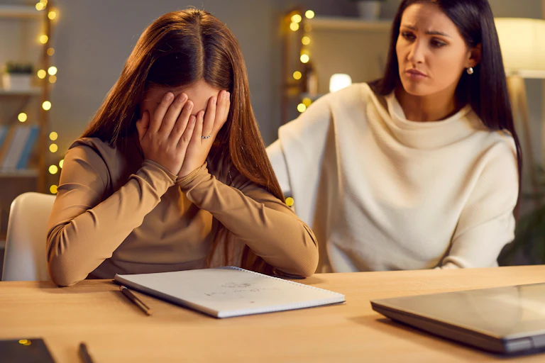 Mother and daughter having a row about a computer