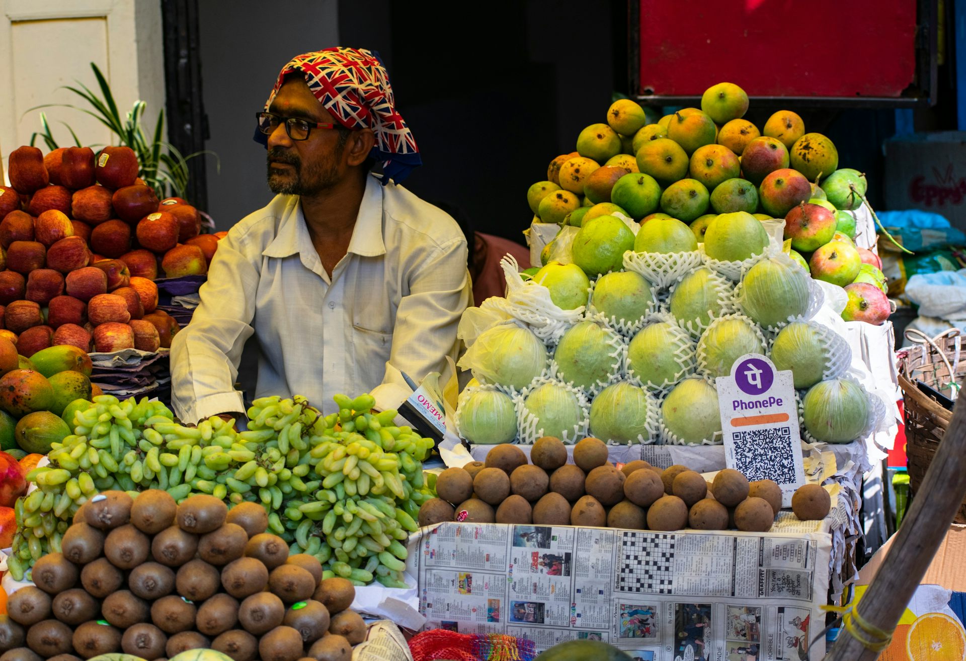 Vegetable stall with QR code display.