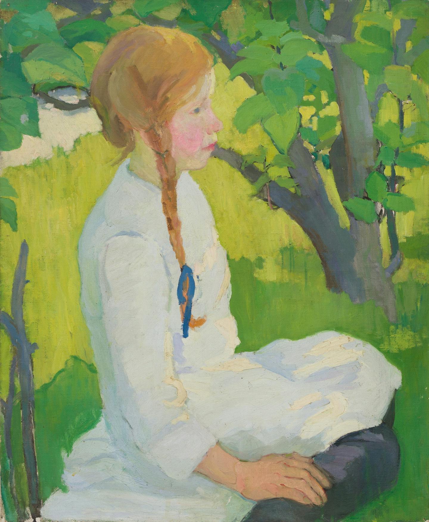 A girl sits outside.