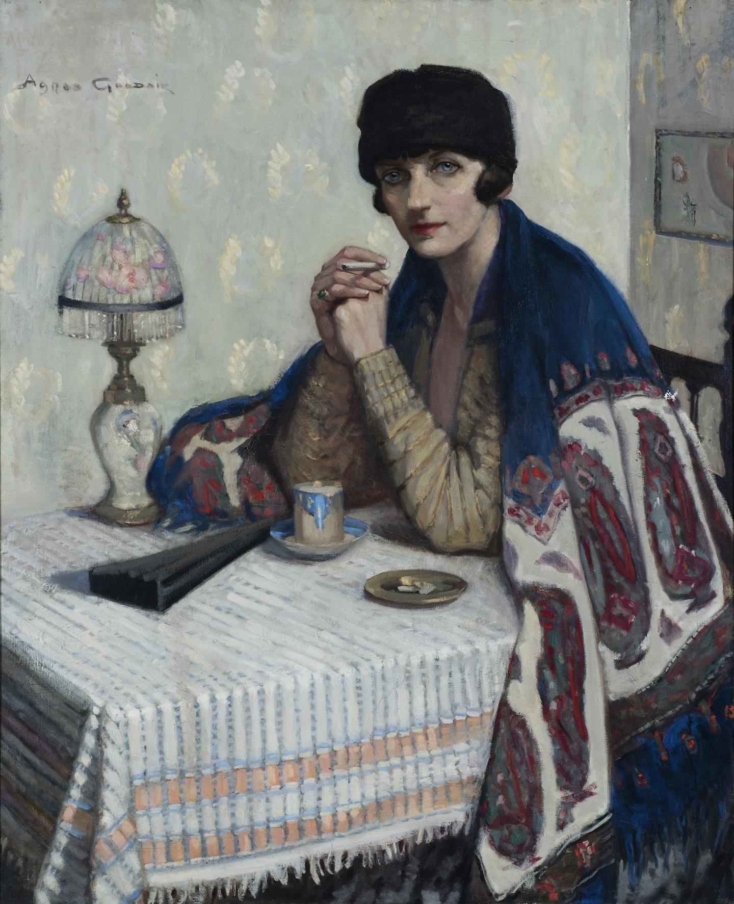 A woman at a cafe table.