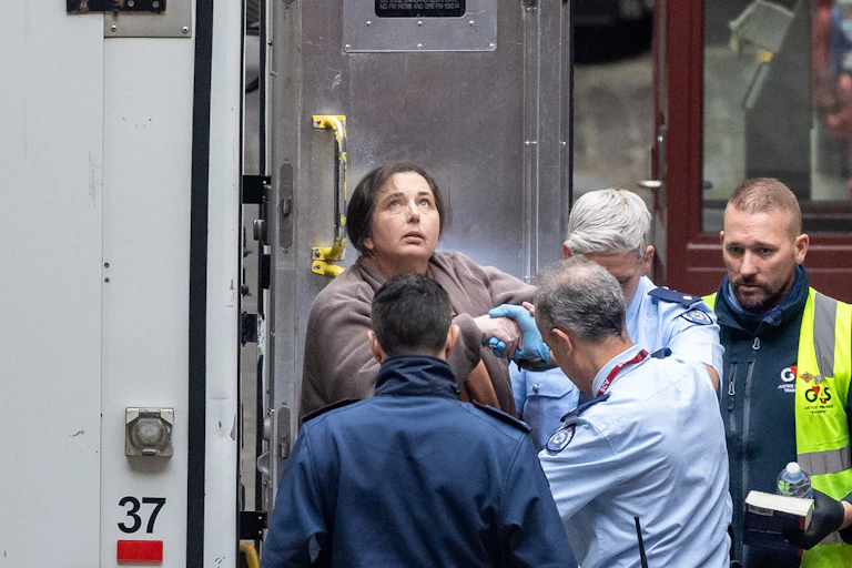 Erin Patterson looking skywards outside the courtroom