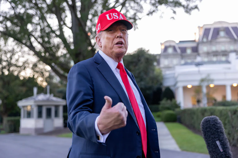 U.S. President Donald Trump talks to the media