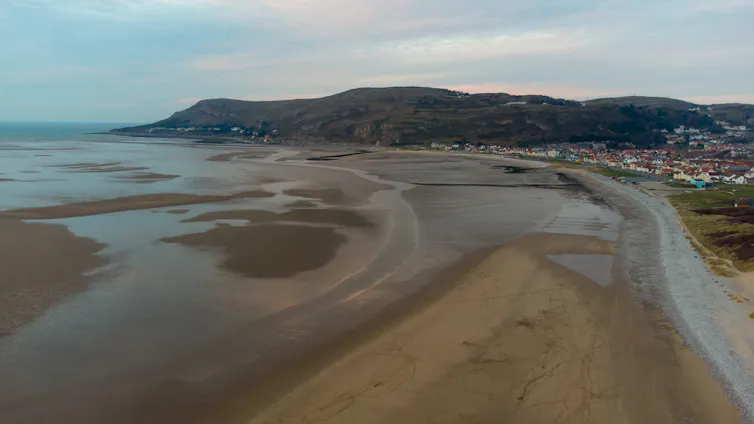 coastline with sandy beach and incoming tide
