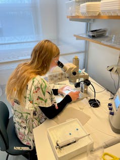 Woman using lab equipment