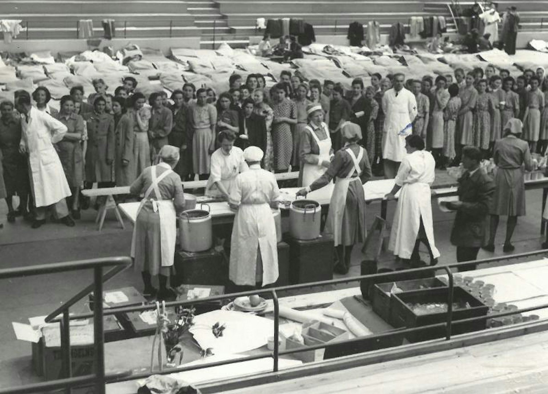 People wait in line for food.