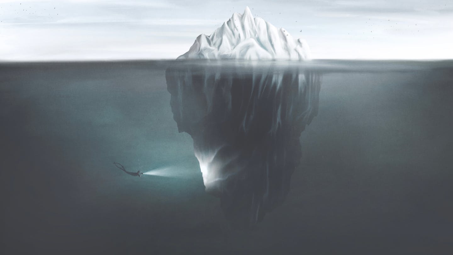 Illustration of scuba diver shining a torch on an iceberg.