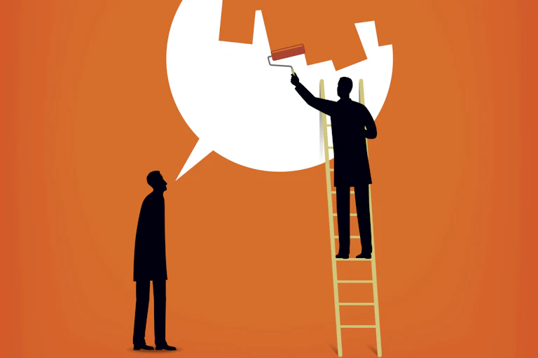 A silhouette of a person stands under a speech bubble, which another silhouette of a person is trying to cover up with a paint roller in a cartoon image with an orange background.