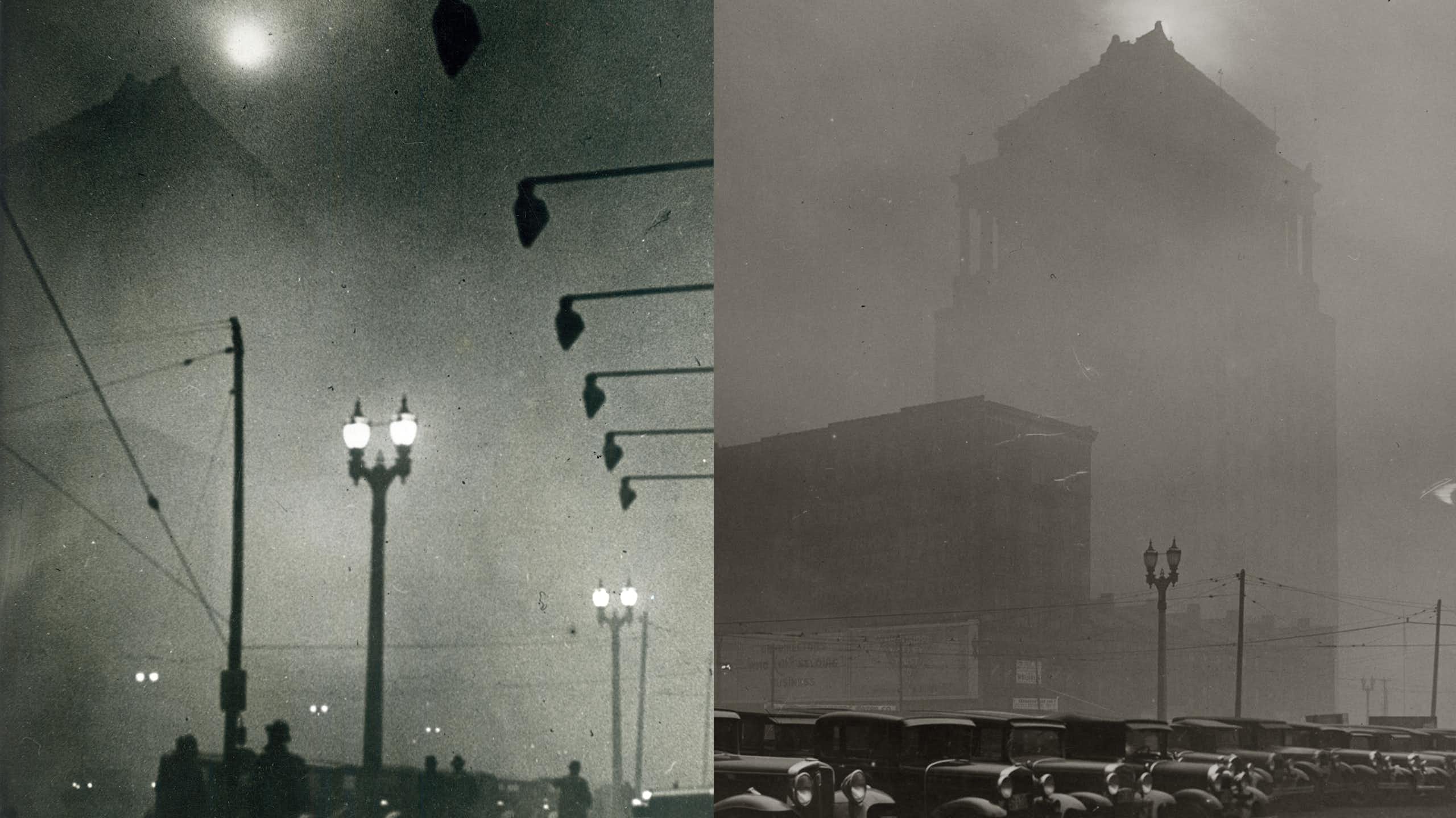 Streetlights and buildings are obscured by dark smoke.