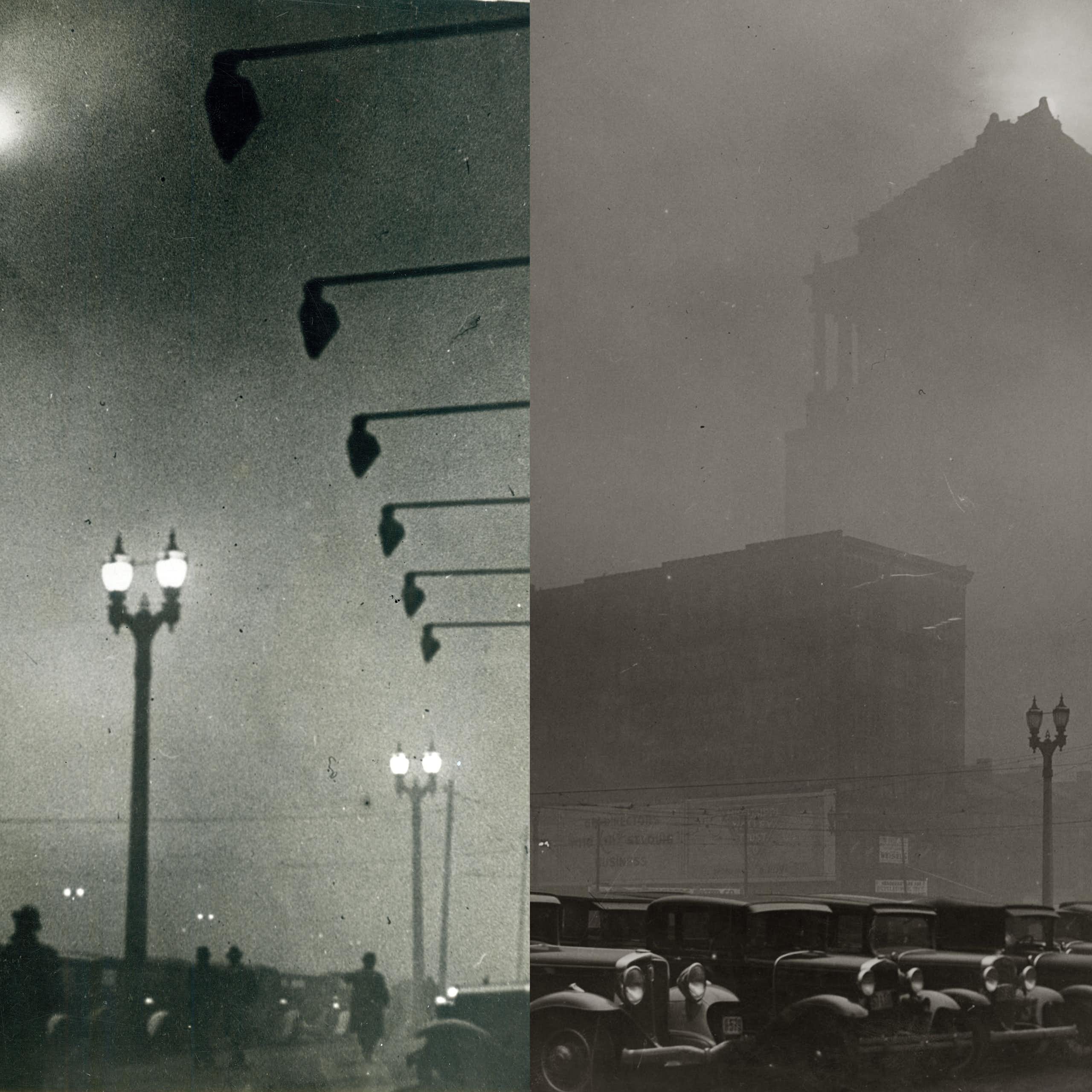 Streetlights and buildings are obscured by dark smoke.
