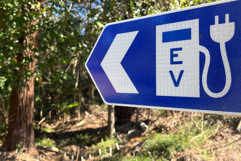 Sign pointing to EV charger