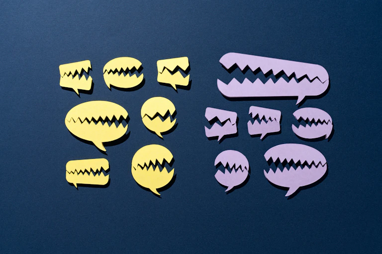 Chat bubbles, with sharp teeth talk to each other.