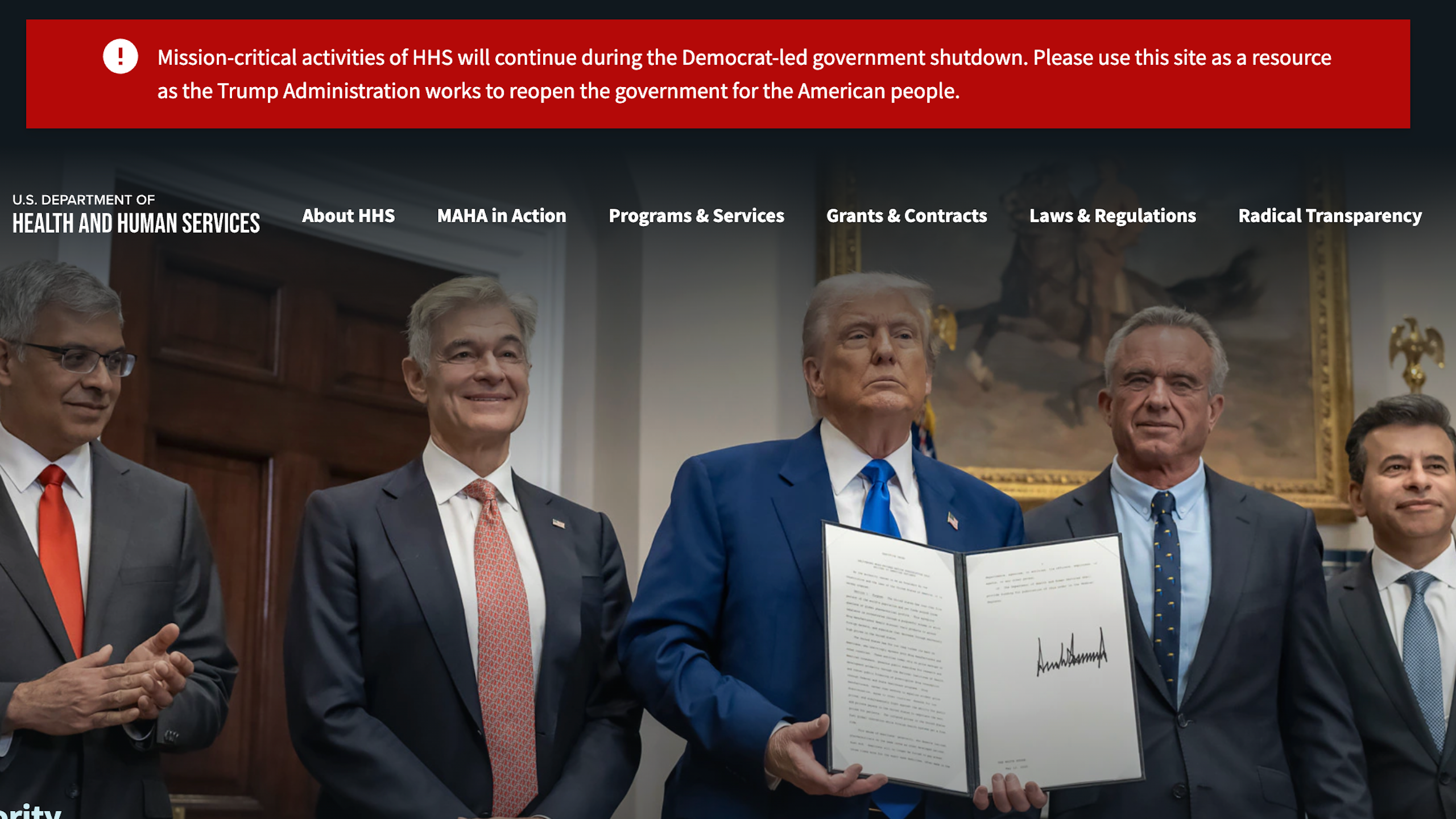 A red banner across a government website, with a message that claims the 'Mission-critical activities of HHS will continue during the Democrat-led government shutdown.'