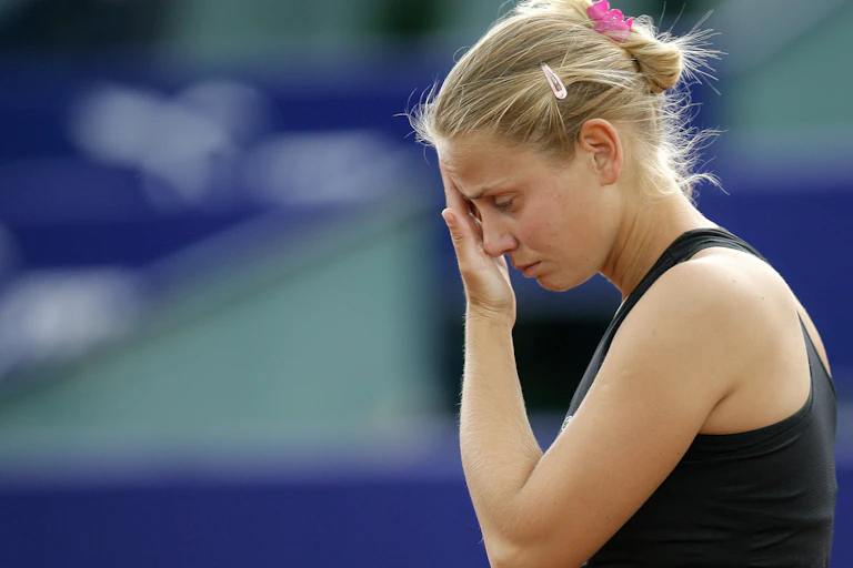 ennis player Jelena Dokic, representing Australia, reacts during a match against France's Karla Mraz, in Bucharest, Romania, Thursday, May 7, 2009.