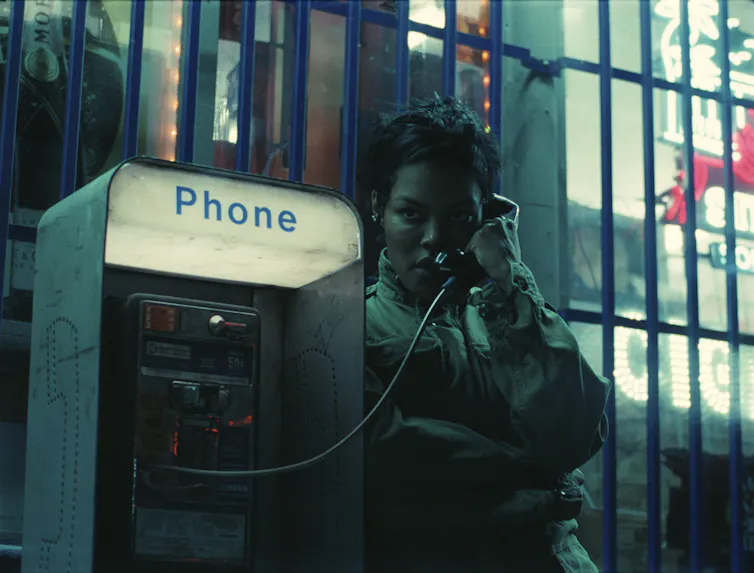 Teyana Taylor on a pay phone.