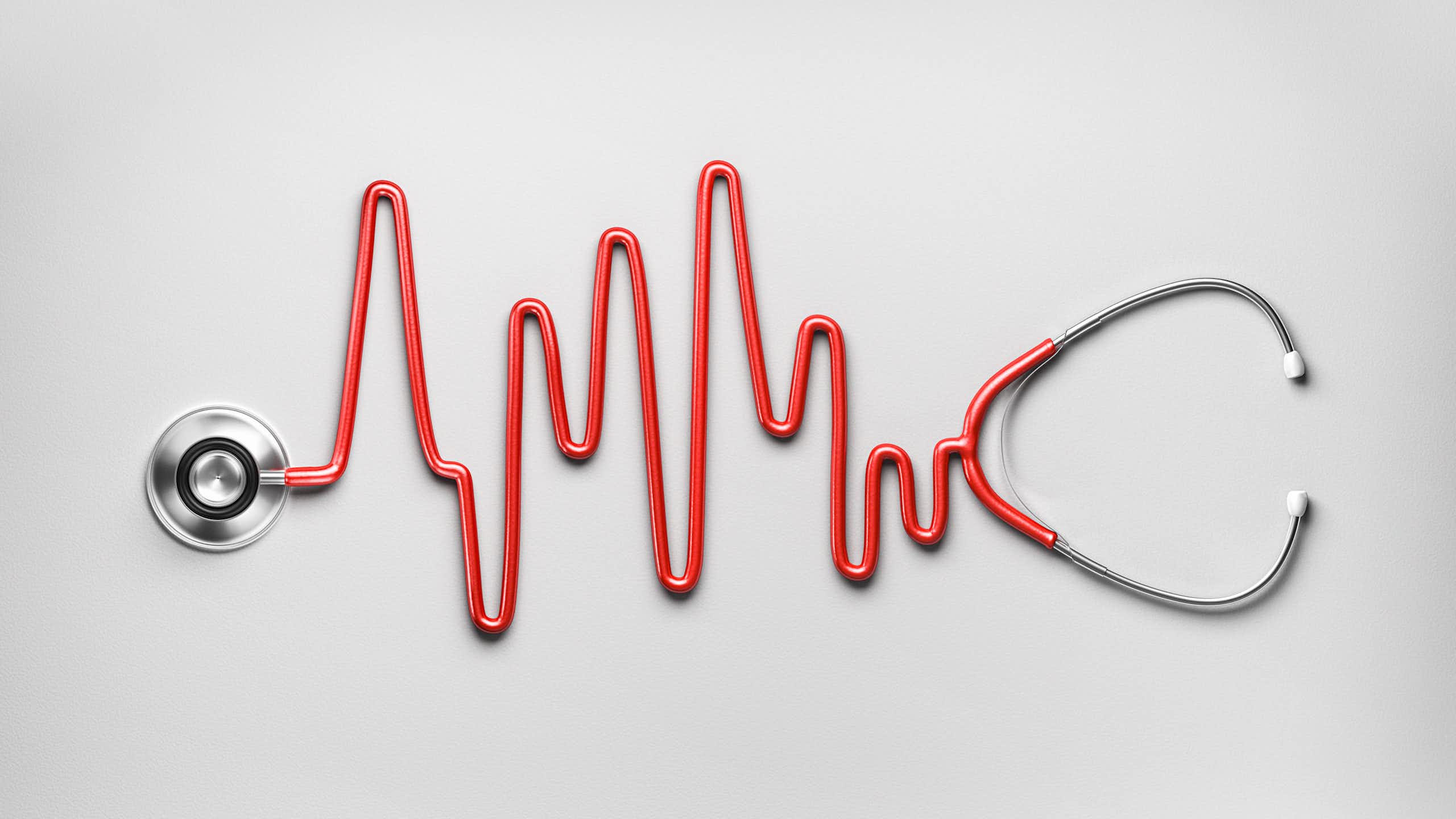Red stethoscope with tube in the shape of an ECG reading