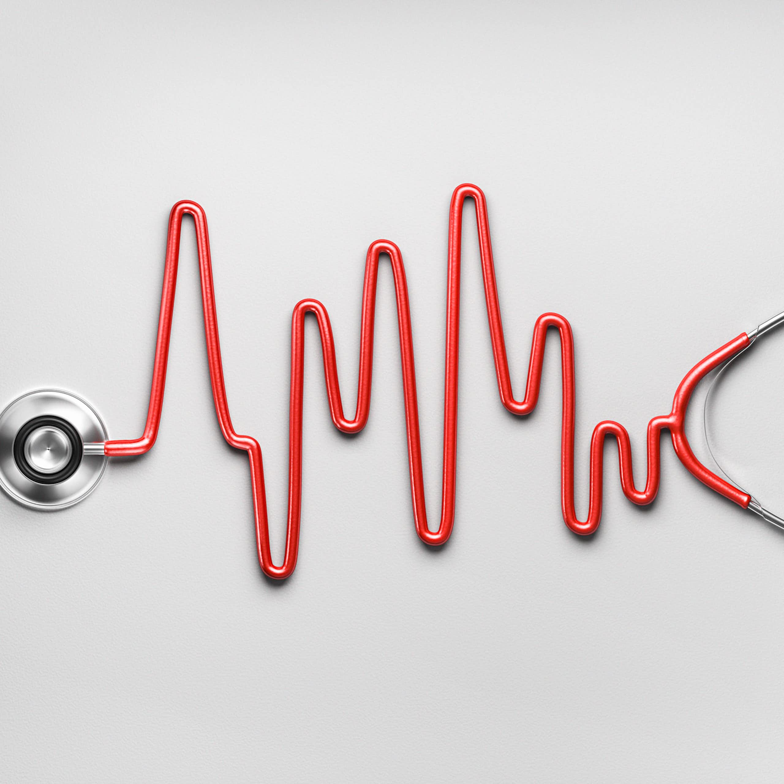 Red stethoscope with tube in the shape of an ECG reading