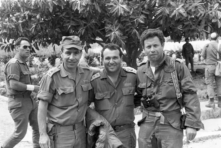 Black and white image of three Israeli military officers in uniform.