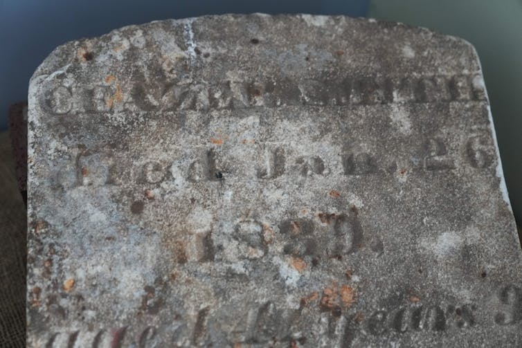 An old, faded tombstone.