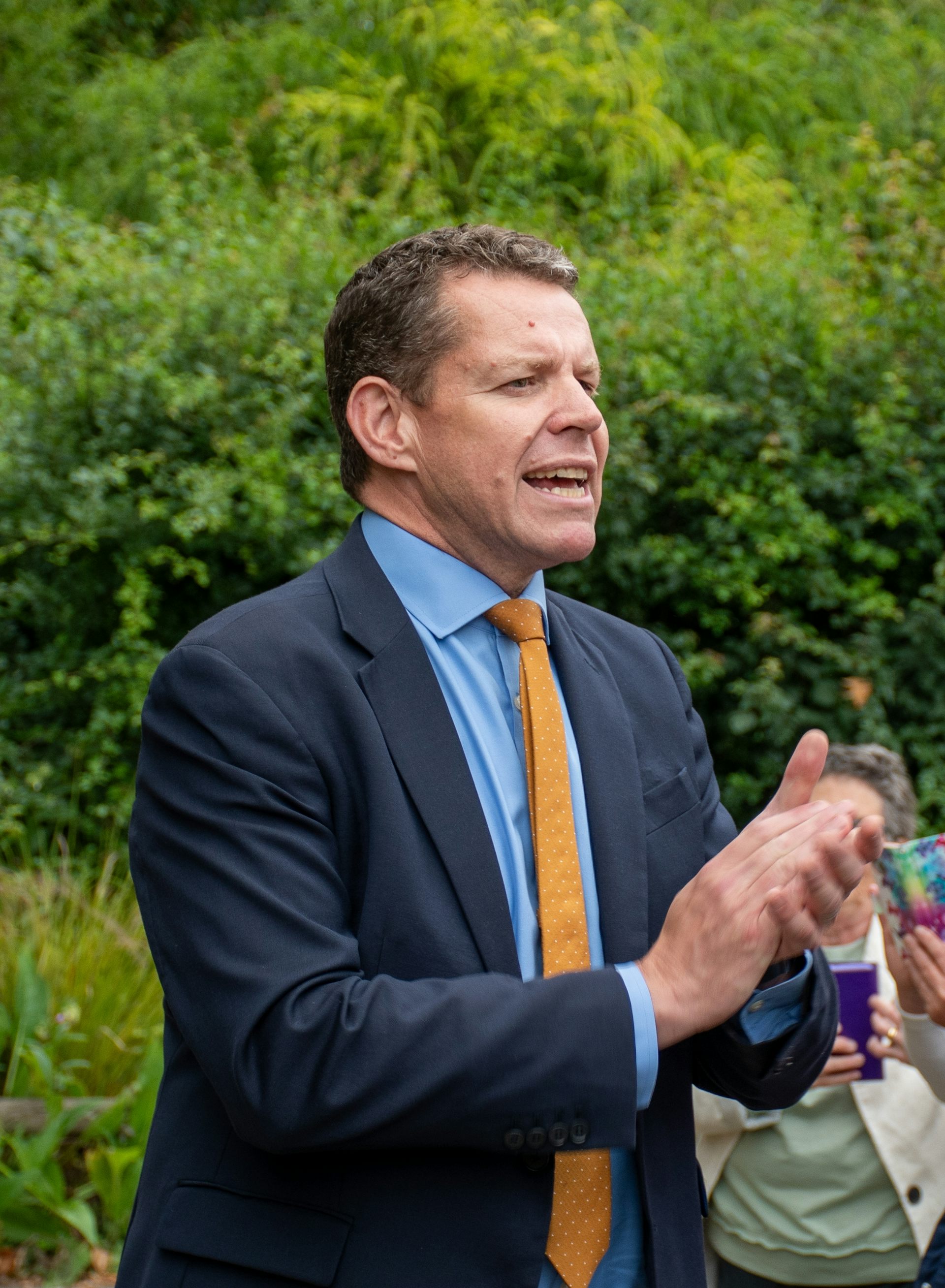 Rhun ap Iorwerth clapping his hands.
