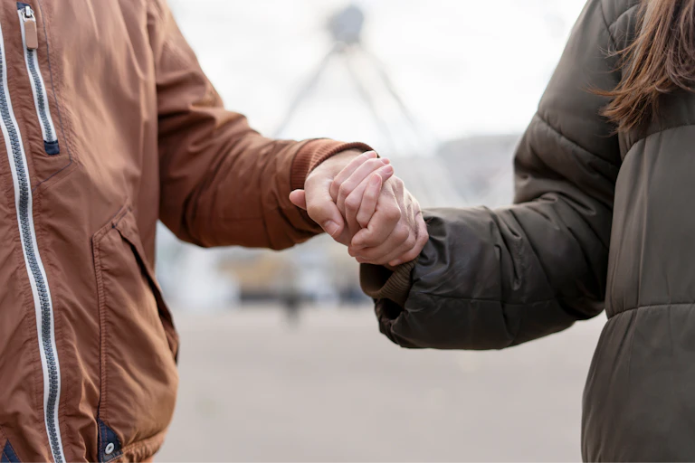 A couple holding hands