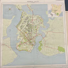 An old map in colour of an island and lines showing how it is accessed.