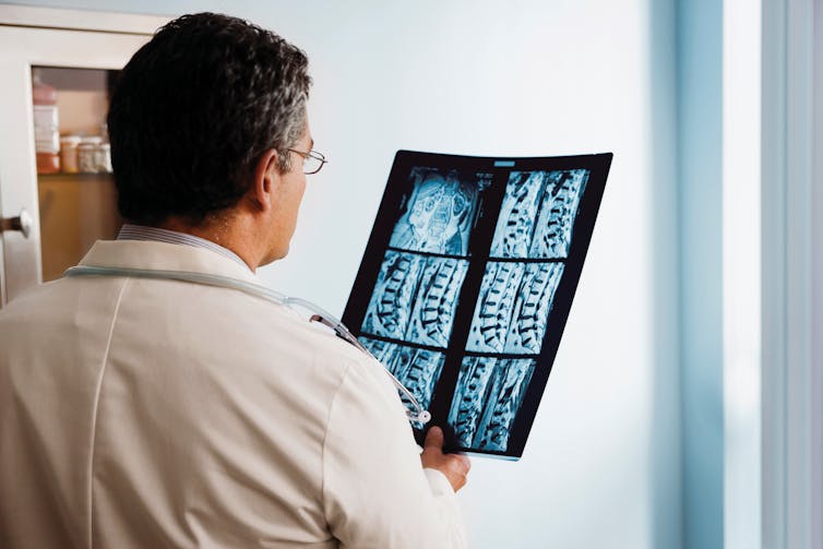 Doctor looking at x-rays