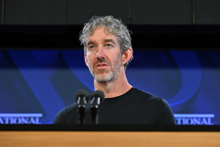 A man in a black t-shirt