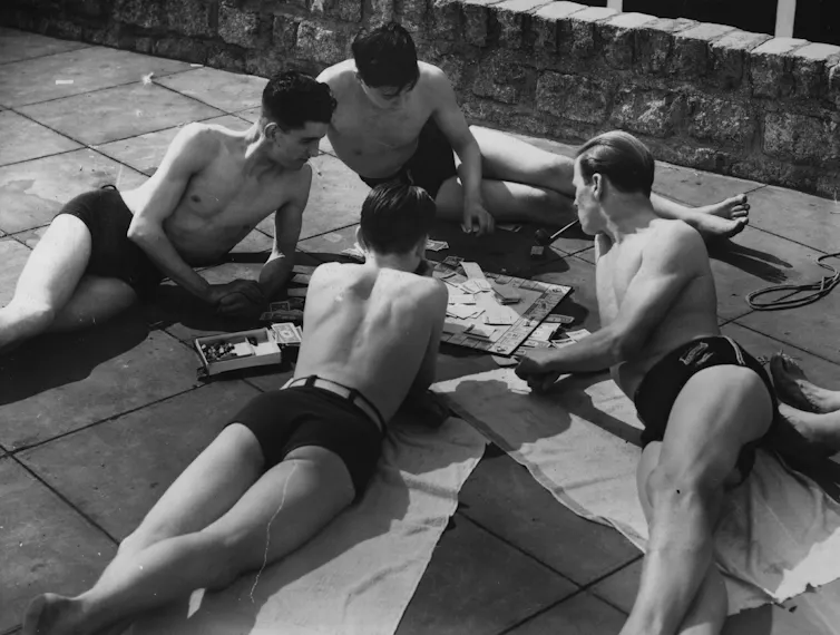 Four men around the board.