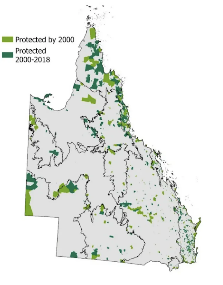 A map of queensland with green dots representing parks