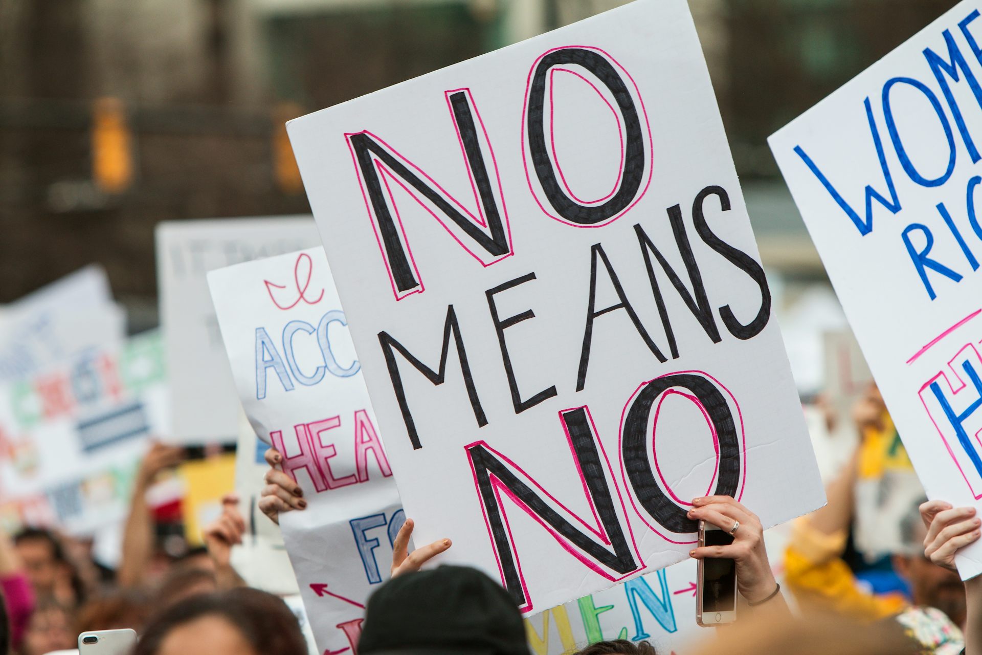 A sign at a protest reading 'No means no'