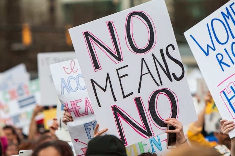 A sign at a protest reading 'No means no'