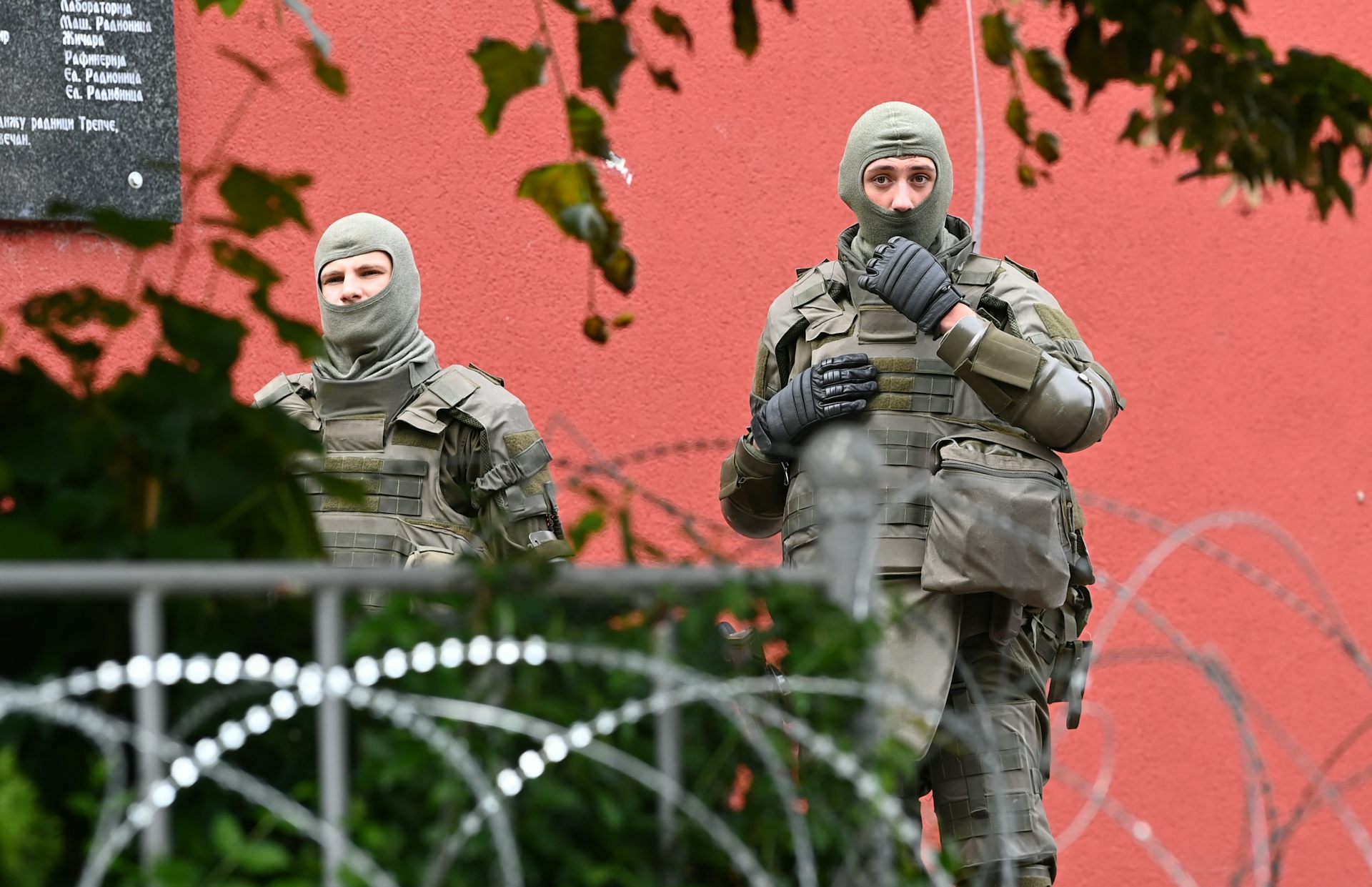 Two male soldiers standing guard in Kosovo.