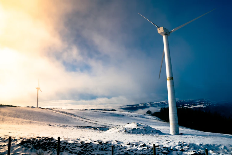 wind turbine coutnryside frosty ground and calm blue skies, no wind
