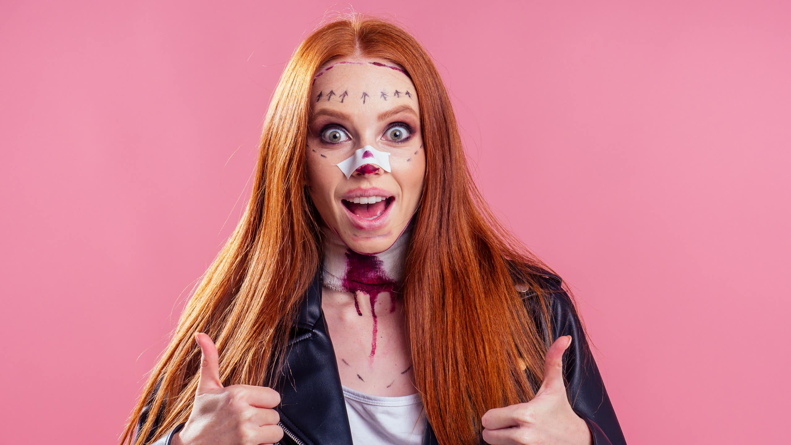 A girl with fake Halloween injuries.