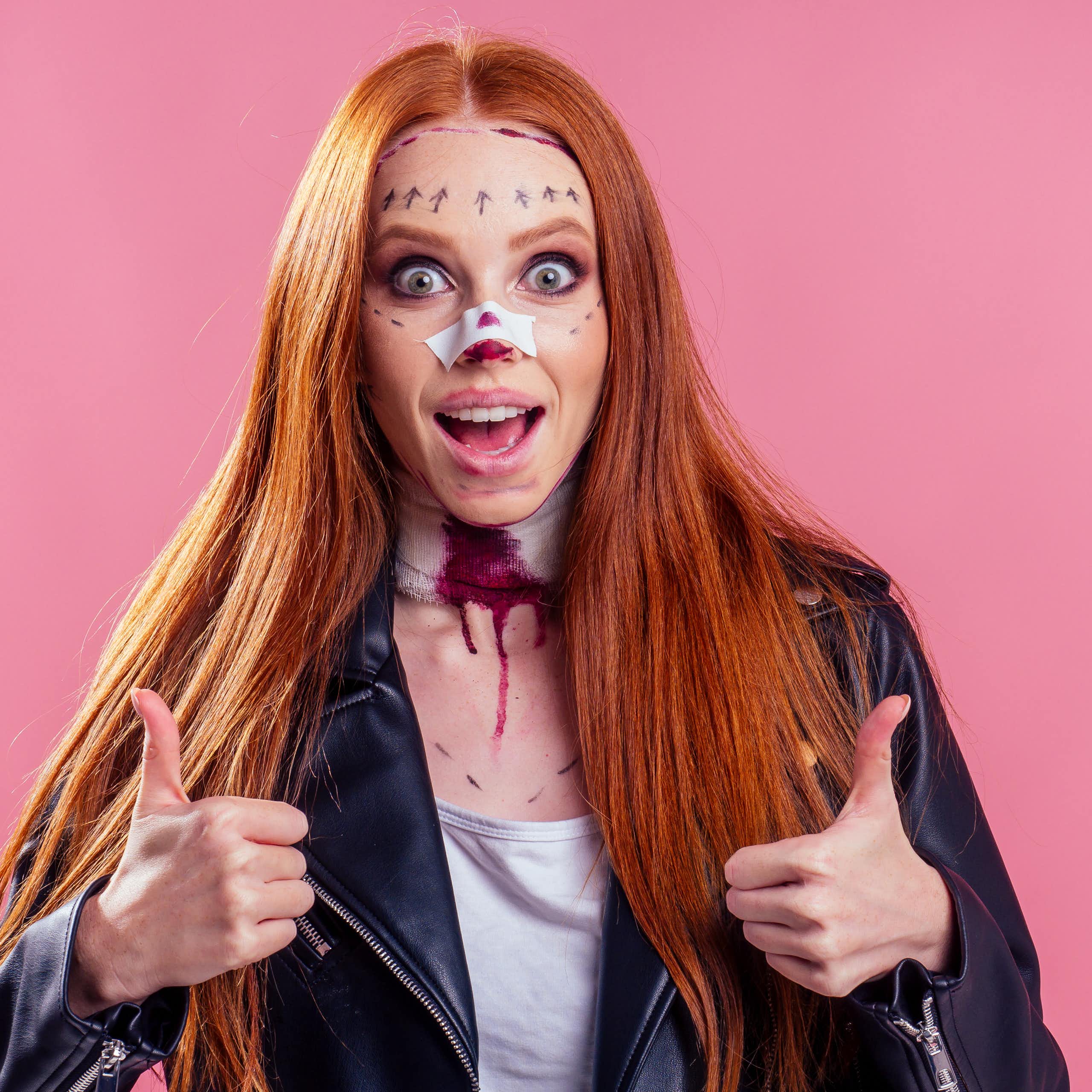 A girl with fake Halloween injuries.