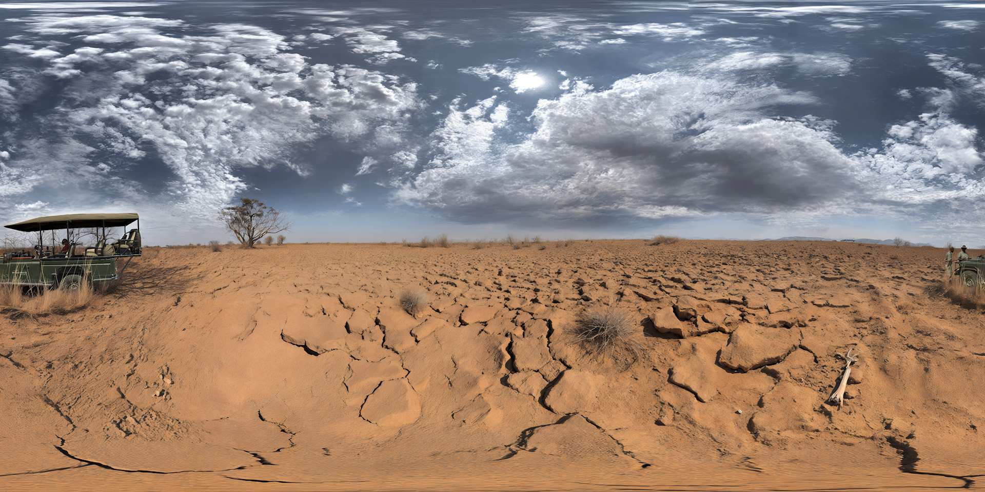 dry cracked ground, dark cloudy skies