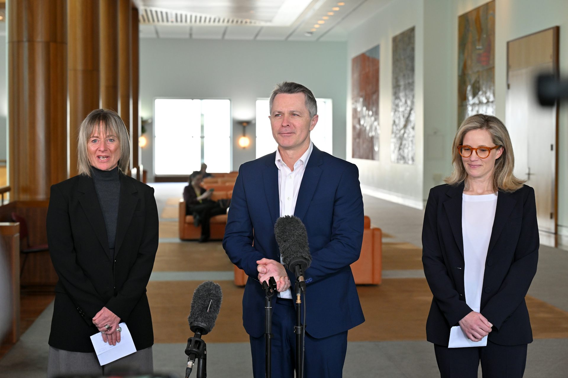 Federal Education Minister Jason Clare at a media conference with bullying review authors Jo Robinson and Charlotte Keating.