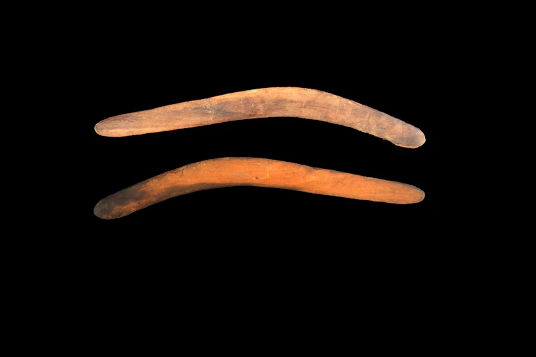 Photo of the front and back of a boomerang
