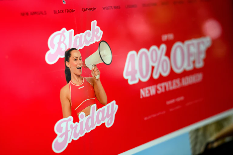 Advertisements for Black Friday sales are seen online on a laptop screen
