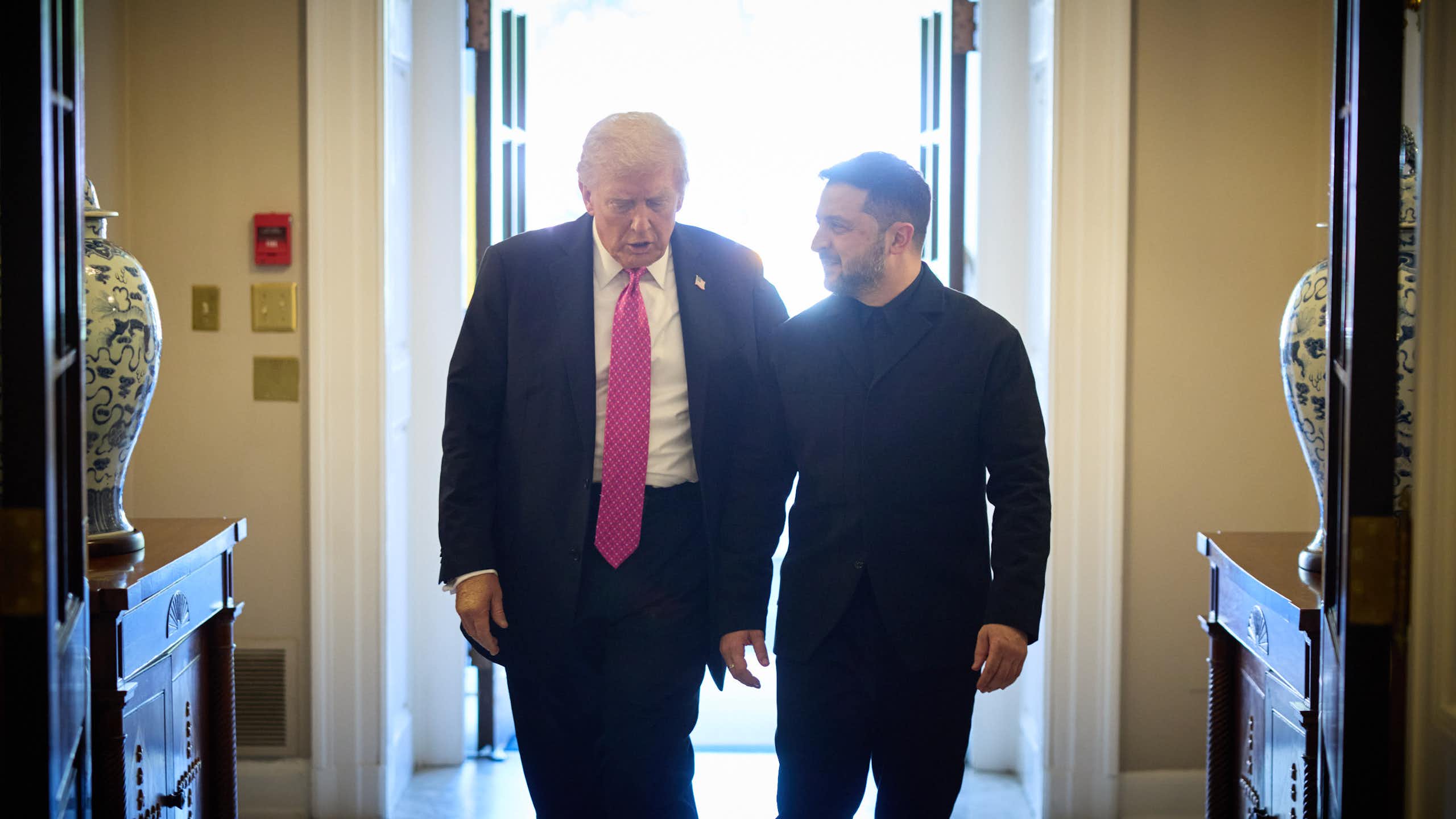 Donald Trump and Volodymyr Zelensky walk into the White House.