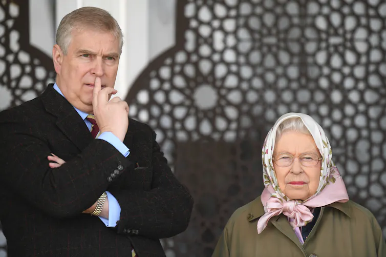 Andrew pictured with his mother, the late queen