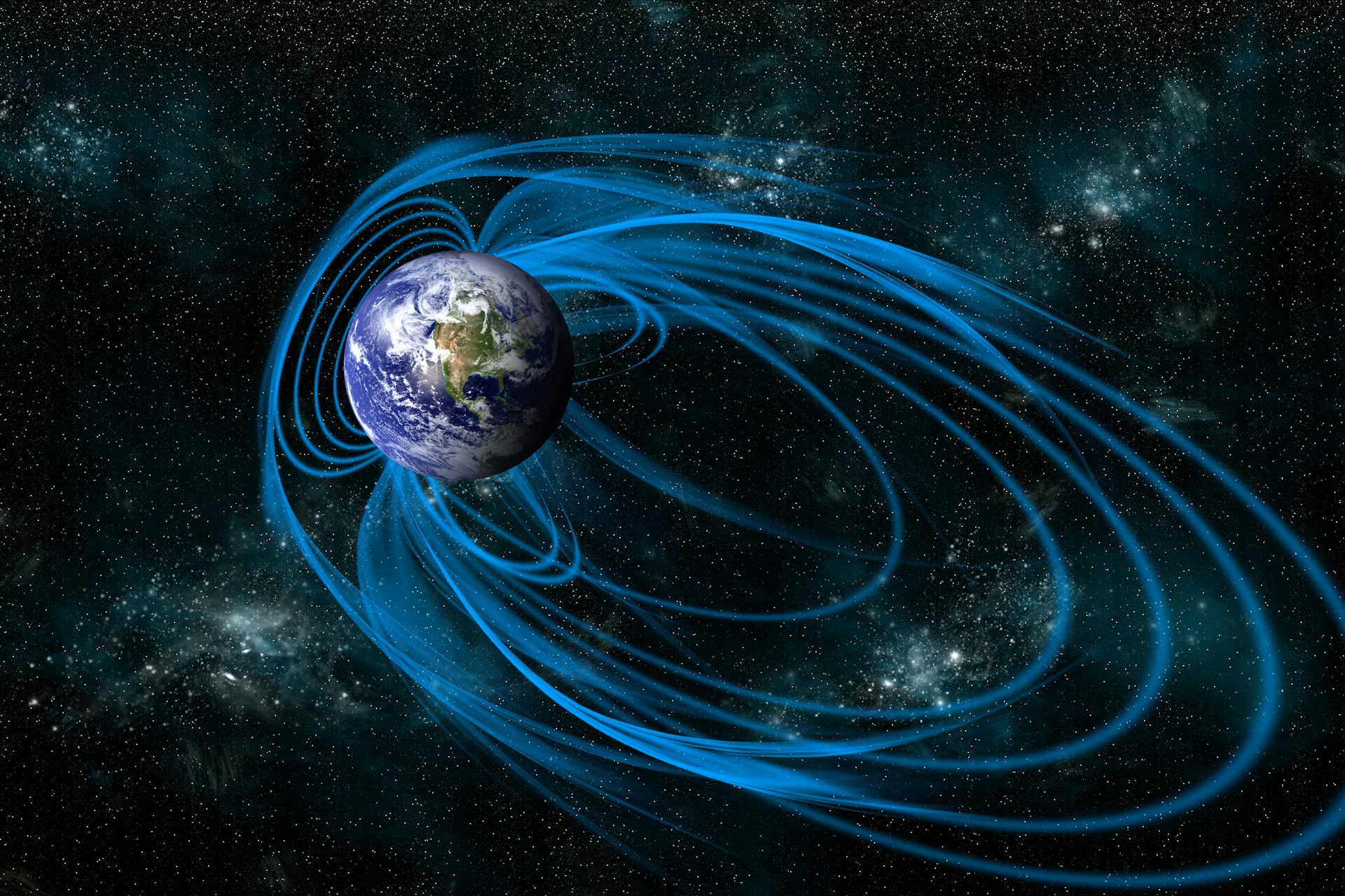 La Terre dans l'espace, avec son champ magnétique représenté par des lignes bleues.