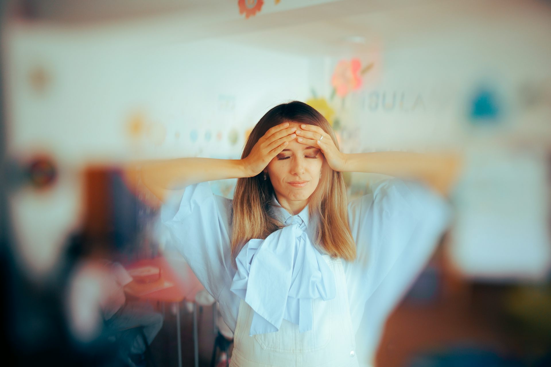 Stressed teacher with blurred background
