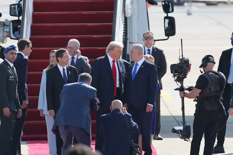 Donald Trump and Benjamin Netanyahu meet at the foot of steps from Airforce One.